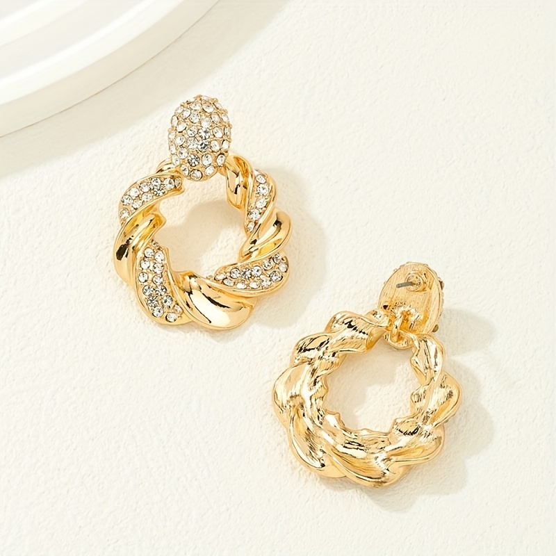 Hollow Twisted Pattern Dangle Earrings with Rhinestone Inlay